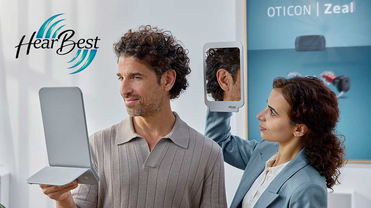 Audiologist fitting Oticon Zeal nearly invisible hearing aid at HearBest