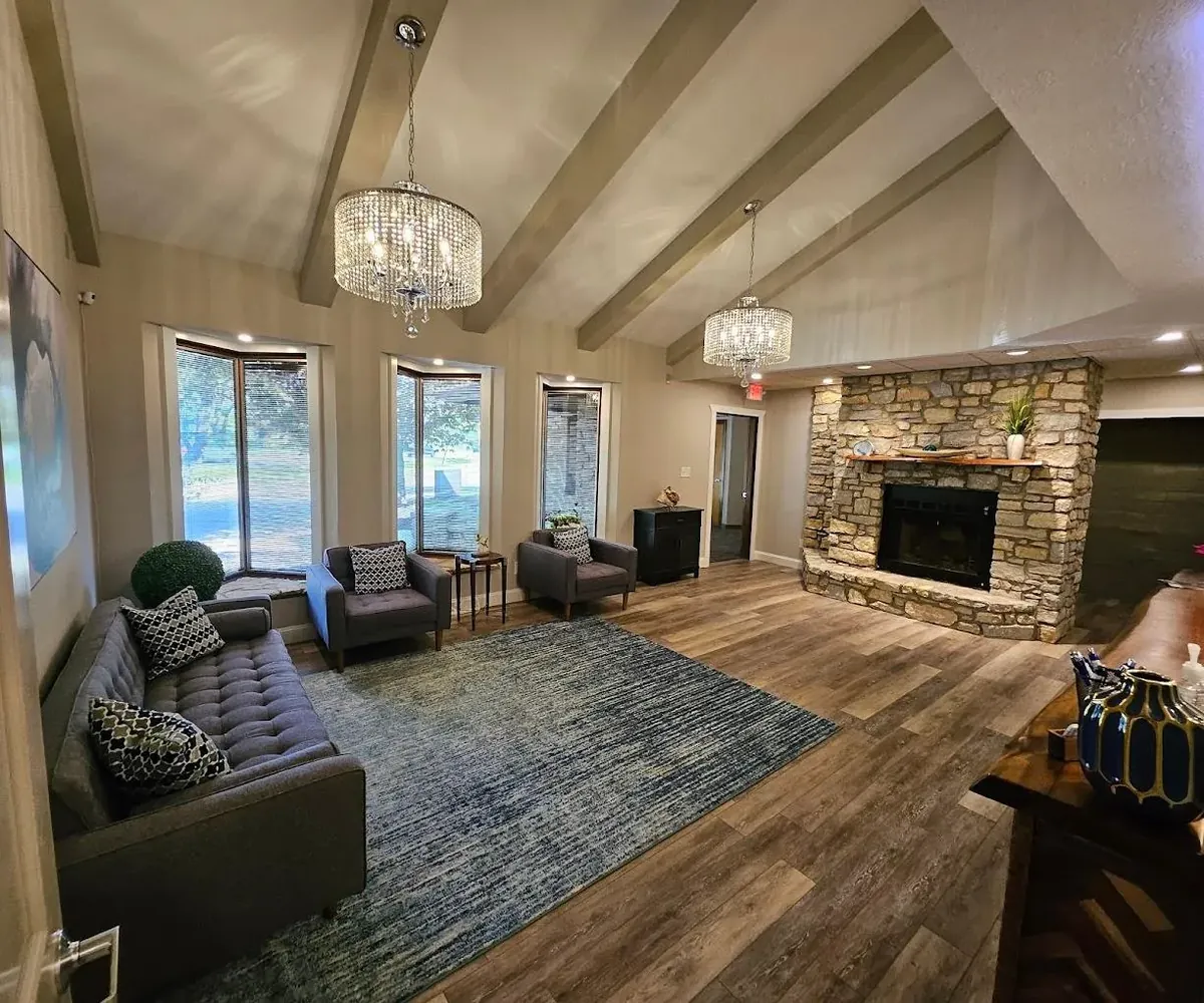 Comfortable HearBest clinic waiting room with fireplace and seating