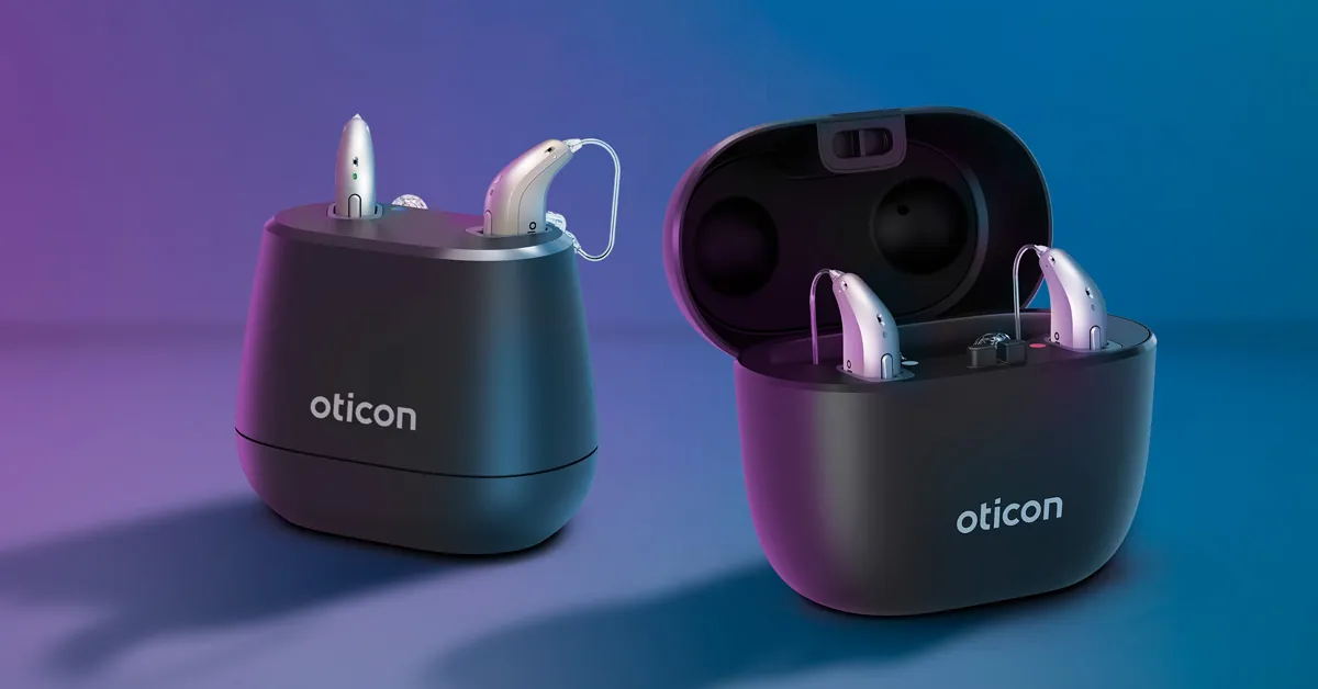 Oticon Reveal hearing aids in the desk charger and portable SmartCharger